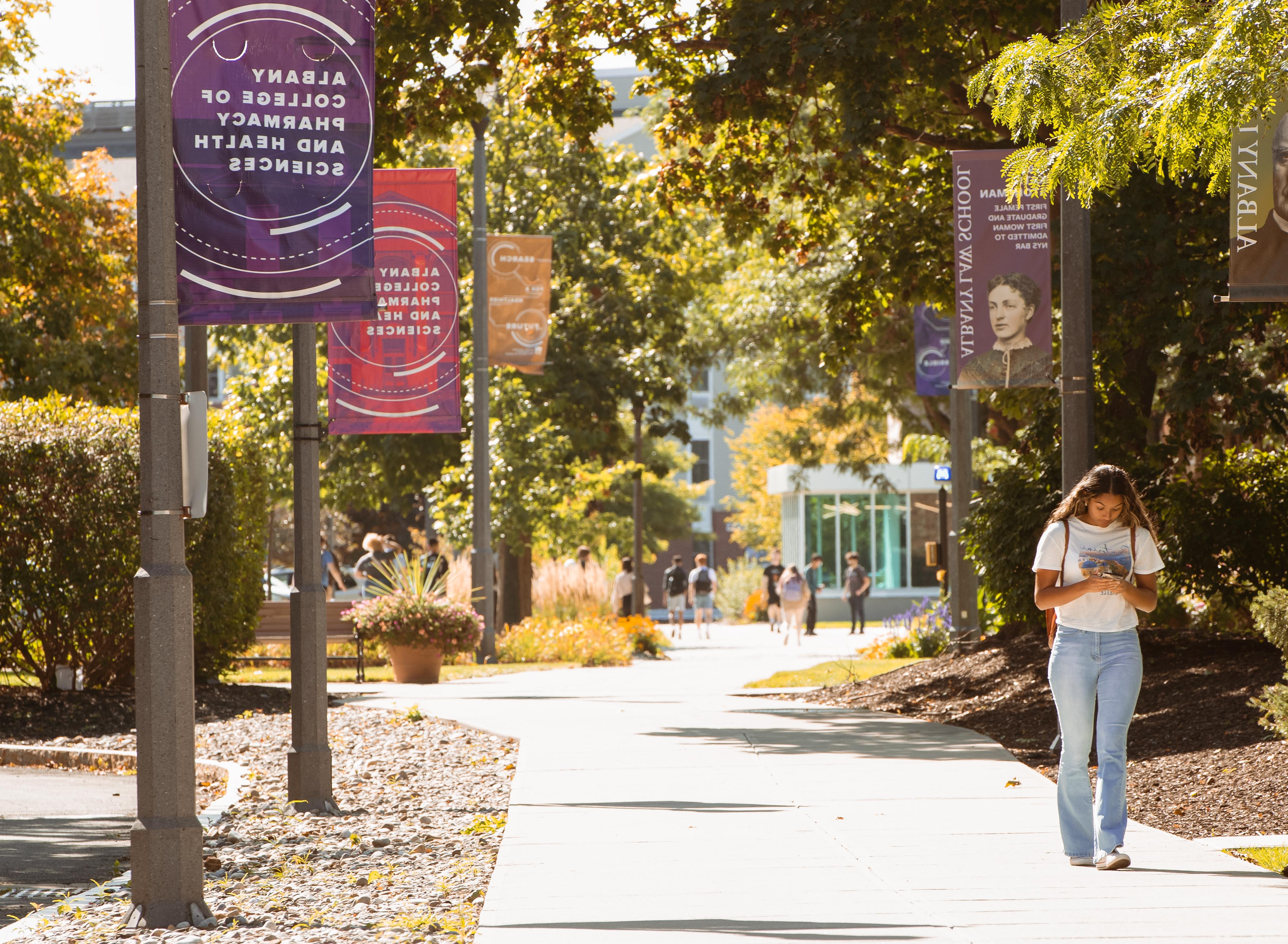 Students walking on campus in summer